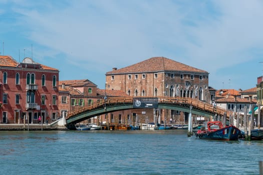 Venice, Italy - July 1, 2021: entering the canal in Murano, the traditional glass manufactoring island of Venice, Italy.