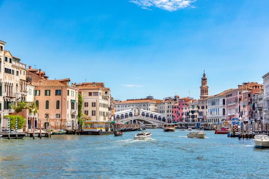 Venice, Italy - July 1, 2021: view from grand canal to rialto bridge in afternoon sun in Venice, Italy.