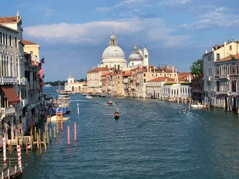 Venice, Italy - July 1, 2021: view to canale grande from bridge Academia in afternoon sun in Venice, Italy.