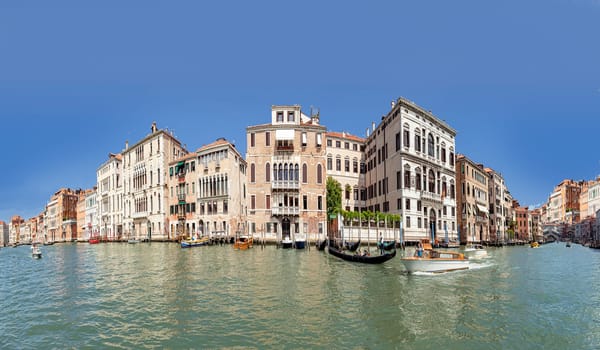 Venice, Italy - July 1, 2021: view to canale grande from bridge Rialto in afternoon sun in Venice, Italy.