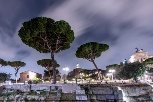 Rome, Italy - August 4, 2021: night view of the roman forum with archaeolocial site in Rome, Italy