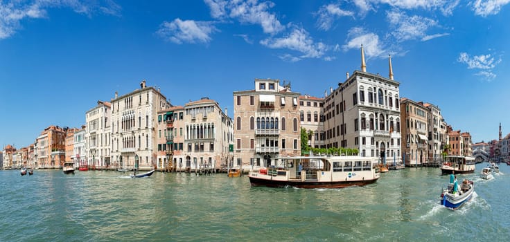 Venice, Italy - July 1, 2021: view to canale grande from bridge Rialto in afternoon sun in Venice, Italy.