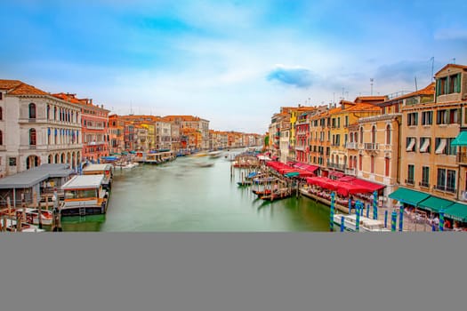Venice, Italy - July 4, 2021: view from Rialto bridge to canale grande in Venice with ships in motion, Italy.