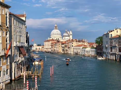 Venice, Italy - July 1, 2021: view to canale grande from bridge Academia in afternoon sun in Venice, Italy.