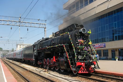 Novosibirsk, Russia - July 20, 2018: Vintage steam locomotive. Open-air museum. locomotive or engine is a rail transport vehicle that provides the motive power for a train.