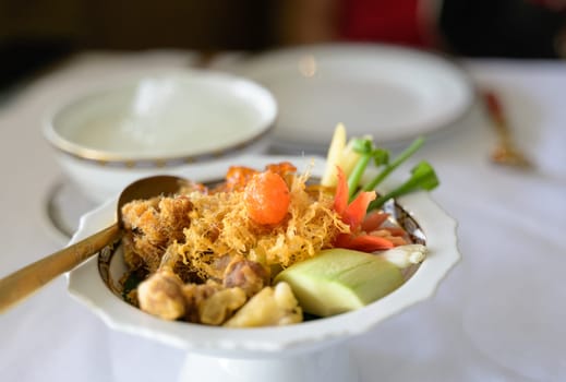 Khao chae, rice in cool water or ice served with fried sweet pork, fried shrimp paste,fried egg and vegetable. Thai food, popular menu in summer