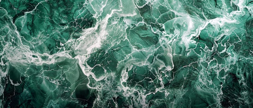 This panoramic image features a vast expanse of crystalline green marble, with a complex network of fractures and veins that create a breathtaking natural mosaic