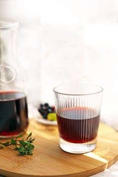 Grape juice poured into a stylish glass