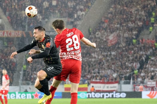 Header duel against Ruben Aguilar (RC Lens) and Matthias Ginter (SC Freiburg) during the match of the Football Europa League - Qualification 1/8 Final,SC Freiburg vs RC Lens
