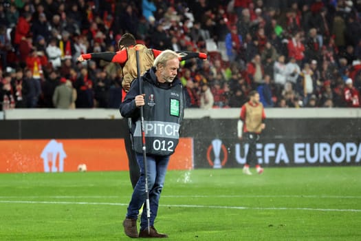 Groundskeeper Alfred Melcher during the lawn care during the half-time break at the match of the Football Europa League - Qualification 1/8 Final,SC Freiburg vs RC Lens