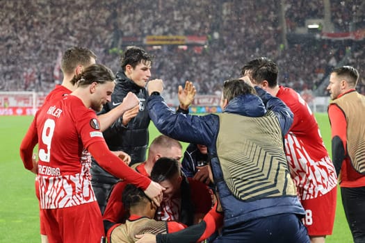 Jubilation,hustle and bustle,cheerfulness - The Freiburg players with athletics coach Daniel Wolf (SC Freiburg) celebrate the 2:2 equalizer of Torschuetze,goal scorer Roland Sallai (SC Freiburg) at the match of the Football Europa League - Qualification 1/8 Final,SC Freiburg vs RC Lens