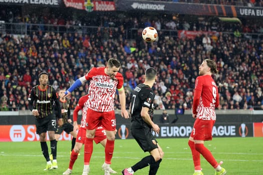 Substitute Christian Günter (SC Freiburg) heads the ball out of the danger zone during the match of the Football Europa League - Qualification 1/8 Final,SC Freiburg vs RC Lens