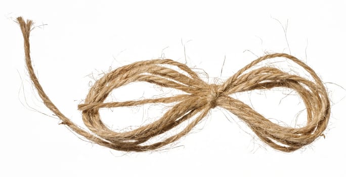 Knotted brown jute rope bow, wrapping material, close up