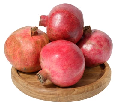 Red ripe pomegranates on a white background, close up