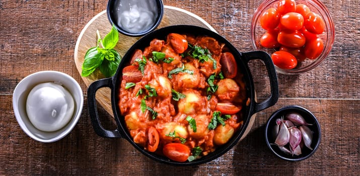 Creamy tomato gnocchi with burrata, basil and garlic.