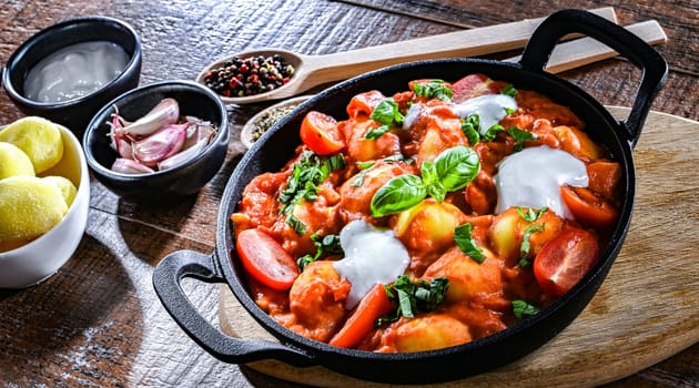 Creamy tomato gnocchi with burrata, basil and garlic.