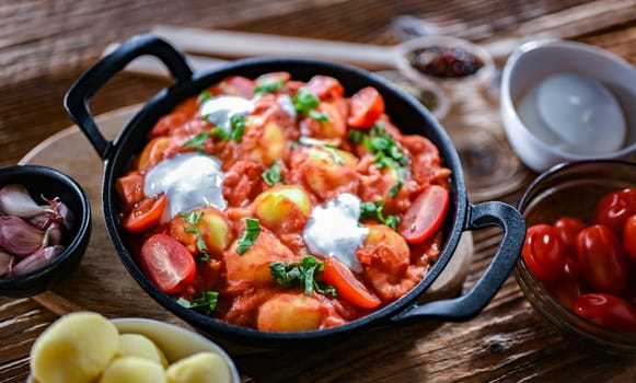 Creamy tomato gnocchi with burrata, basil and garlic.