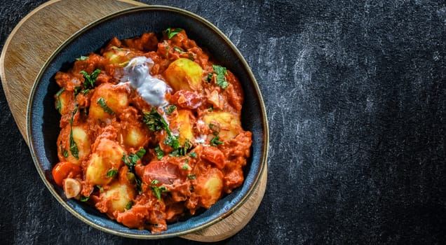 Creamy tomato gnocchi with burrata, basil and garlic.