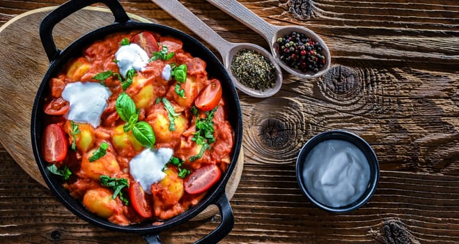 Creamy tomato gnocchi with burrata, basil and garlic.