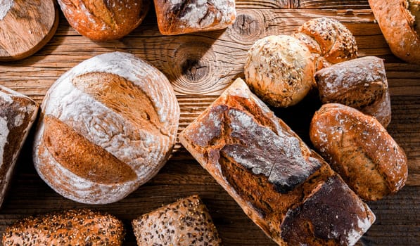 Composition with assorted bakery products on wooden table.