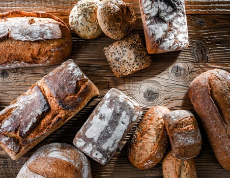 Composition with assorted bakery products on wooden table.