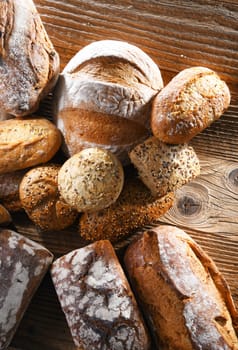 Composition with assorted bakery products on wooden table.