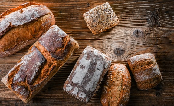 Composition with assorted bakery products on wooden table.