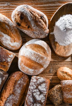 Composition with assorted bakery products on wooden table.