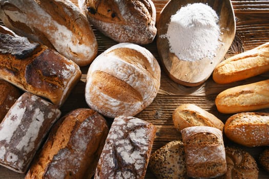Composition with assorted bakery products on wooden table.