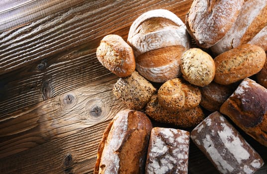 Composition with assorted bakery products on wooden table.