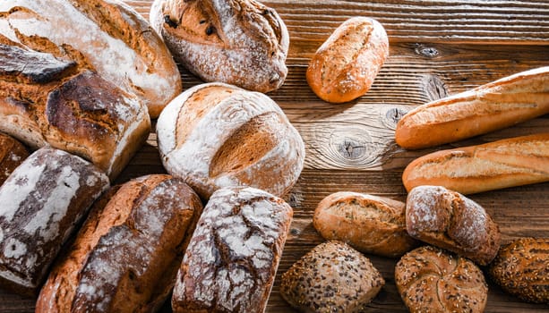 Composition with assorted bakery products on wooden table.