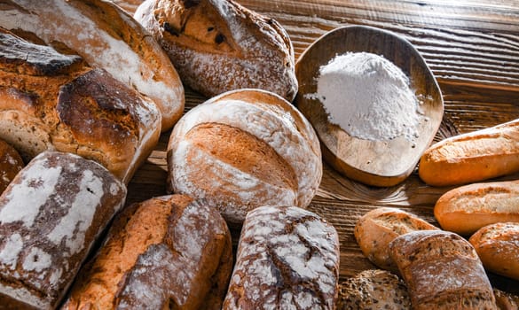 Composition with assorted bakery products on wooden table.