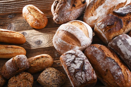 Composition with assorted bakery products on wooden table.