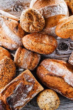 Composition with assorted bakery products on wooden table.