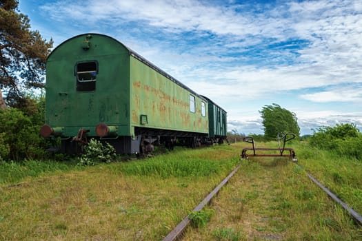 old abandoned lonely railway carriages on disused train route