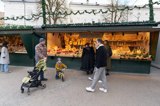 Market stall with wooden products for the home at the Christkindlmarkt, Christmas market in Salzburg, Austria