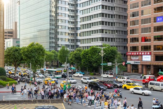 Taiwan 13 June 2023: People cross the road in Taipei city
