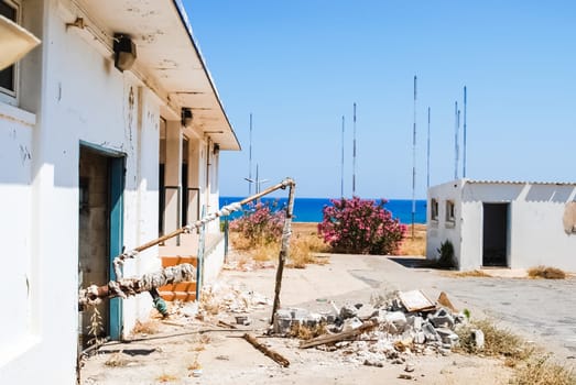 Abandoned US Air Force Base, Crete Island, Greece - June 10, 2015: Abandoned US Air Force Base Crete, Greece. Abandoned buildings and structures have fallen into disrepair and are destroyed.