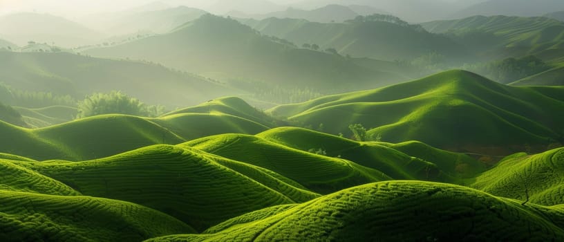 Sunlight filters through the clouds, illuminating the vivid green folds of mountainous terrain. The landscape is alive with the dance of light and life