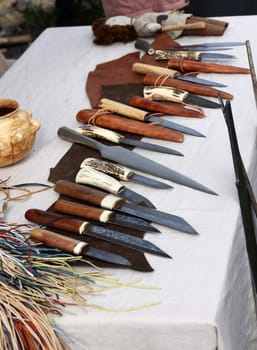 Cracow, Poland - April 11, 2023: Handmade imitations of medieval knives in knight camp at the festival of historical reconstruction
