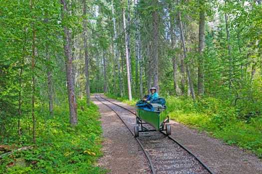 Portaging a Canoe on a Rail Portage in Prince Albert National Park in Saskatchewan