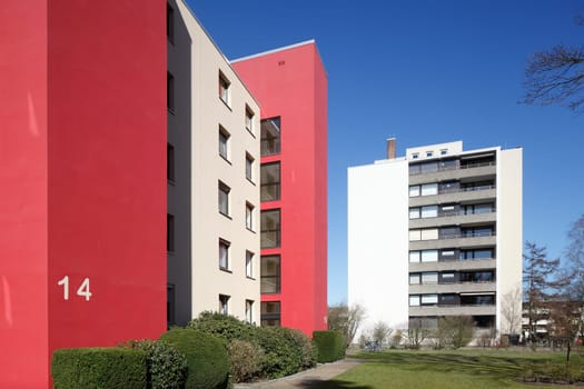 Modern, red and white residential building in spring, Findorff, Bremen, Germany