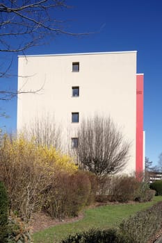 Modern, red and white residential building in spring, Findorff, Bremen, Germany