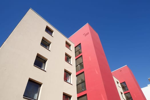 Modern, red and white residential building in spring, Findorff, Bremen, Germany