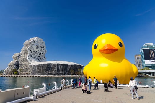 Taiwan, 01 February 2024: Kaohsiung Music Center with yellow duck floating over the bay