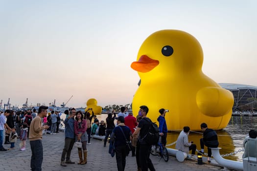 Taiwan, 01 February 2024: Yellow duck in kaohsiung bay in Taiwan in the evening