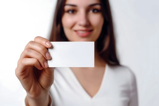 Long-haired young adult Caucasian woman Hand holding blank business card on white background. Neural network generated image. Not based on any actual scene or pattern.