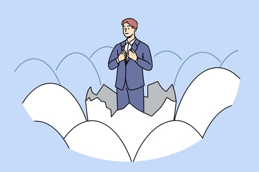 Businessman stands in eggshell as metaphor for emergence of new professional thanks to business education. Ambitious businessman, feels confident in own abilities to obtain managerial position