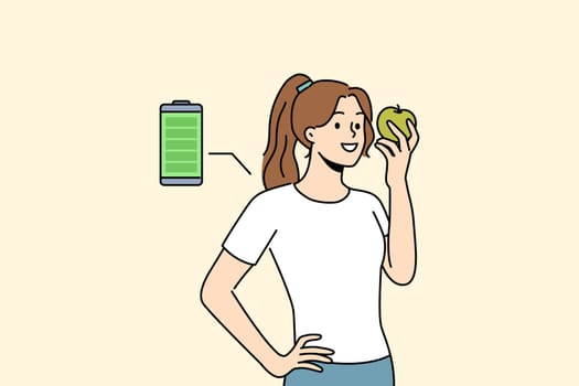 Woman eats fresh apple to recharge with energy and vitamins from fruit bought at farmers market. Full battery charge near girl holding apple helping to quickly regain strength during break