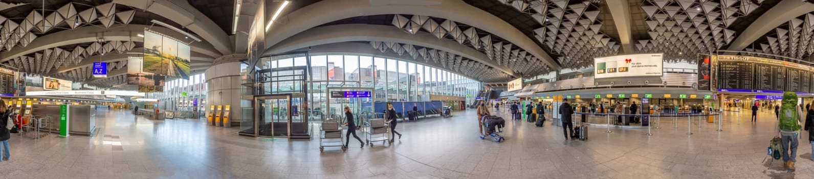 Frankfurt, Germany - February 7, 2022: people hurry to the gate in Frankfurt international airport terminal.